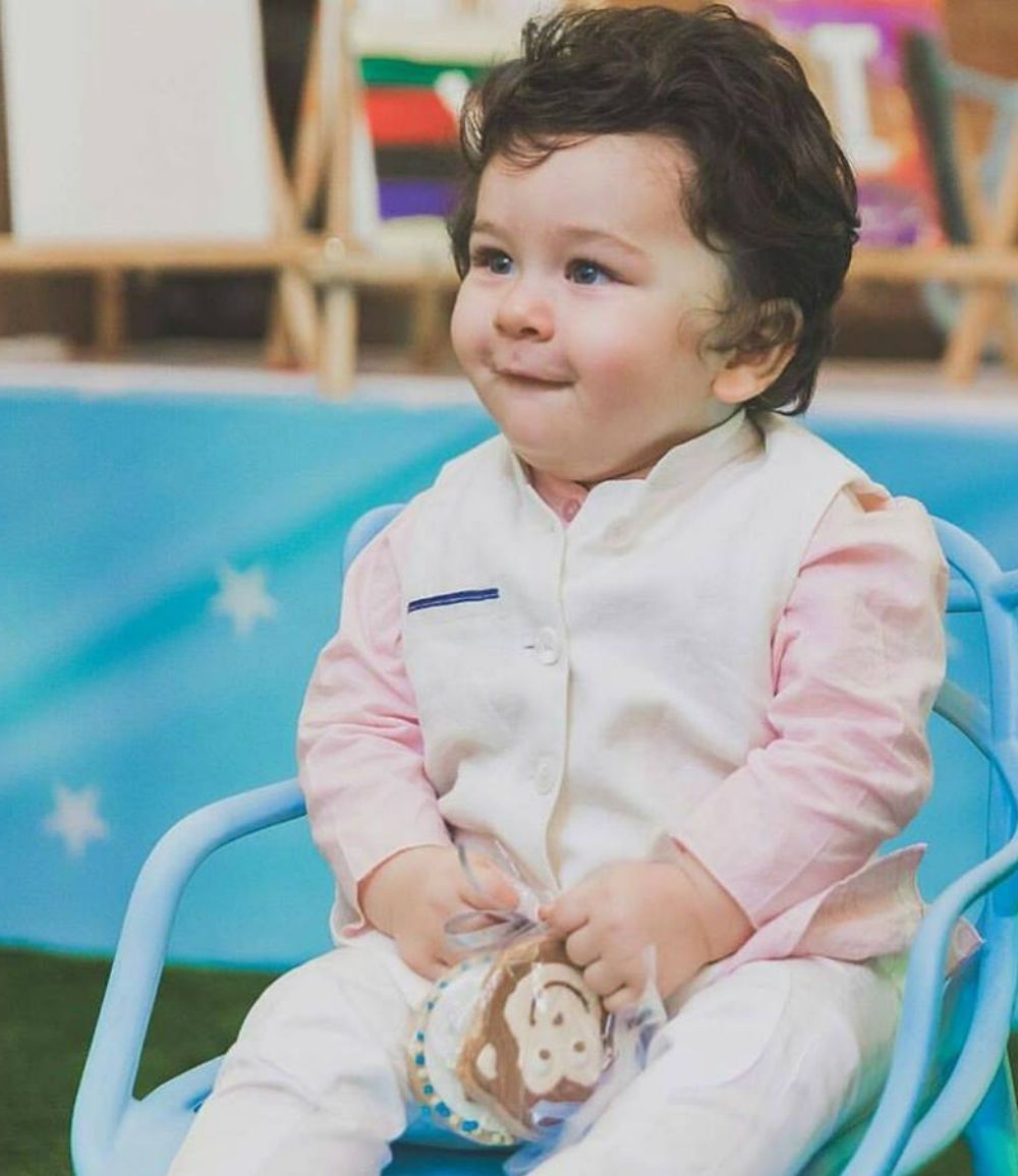 ​Taimur is learning to play this game from Papa Saif 