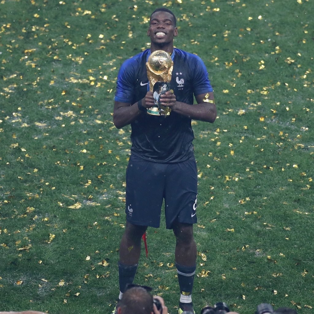 Pogba wins hearts as he held picture of his father with World Cup