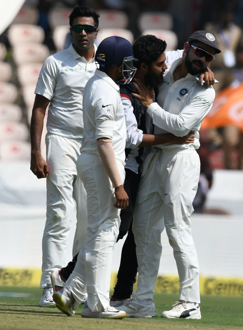 A man tries to hug Virat Kohli, during the India’s clash against West Indies