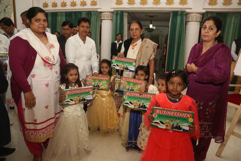 Governor distributes books and sports, painting material to school children
