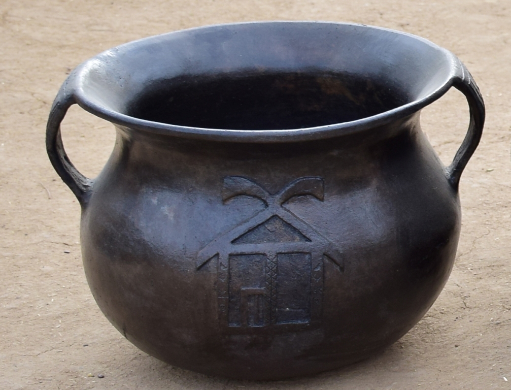 Manipuri traditional artist shapes black clay pottery at IGRMS in ongoing Kumhar Para exhibition