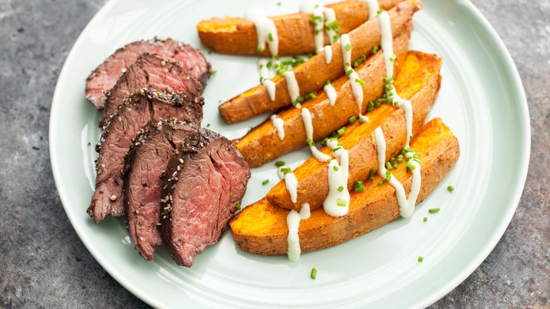 Pepper-Crusted Hanger Steak with Sweet Potatoes and Avocado Crema 