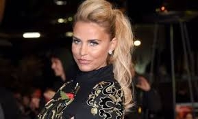  Katie Price poses topless on beach 