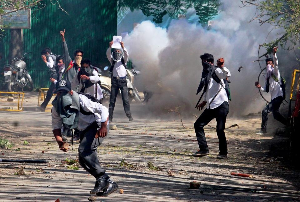  Protesting Kashmiri students beat up cop, torch his motorcycle 
