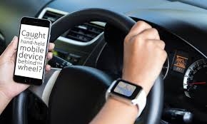  Thousands of UK drivers caught in crackdown on mobile phone use 