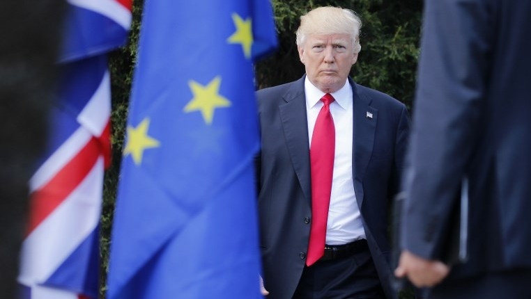  EU head takes aim at Trump on climate deal 