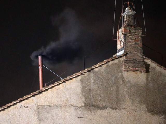  Black smoke billows over Vatican walls 