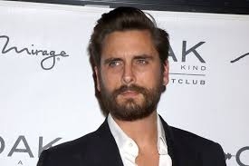  Scott Disick hangs out with topless woman 