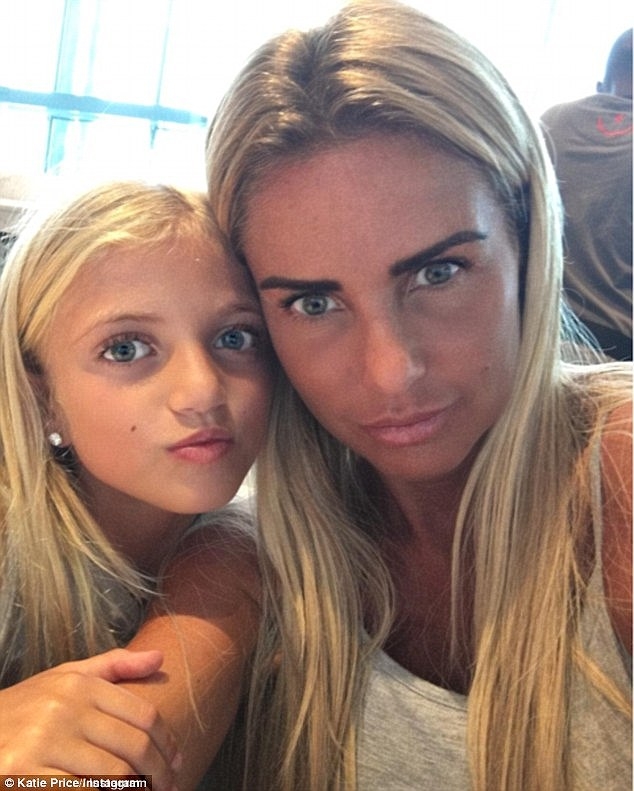  Katie Price shows her topless image to daughter 
