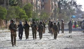 US-backed forces breach wall in Syria s Raqqa 
