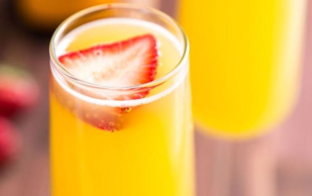 Pineapple Juice Mimosas with Strawberries
