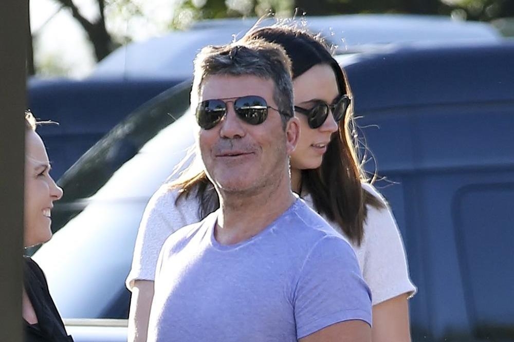  Cowell feel like a  proud dad  towards One Direction 